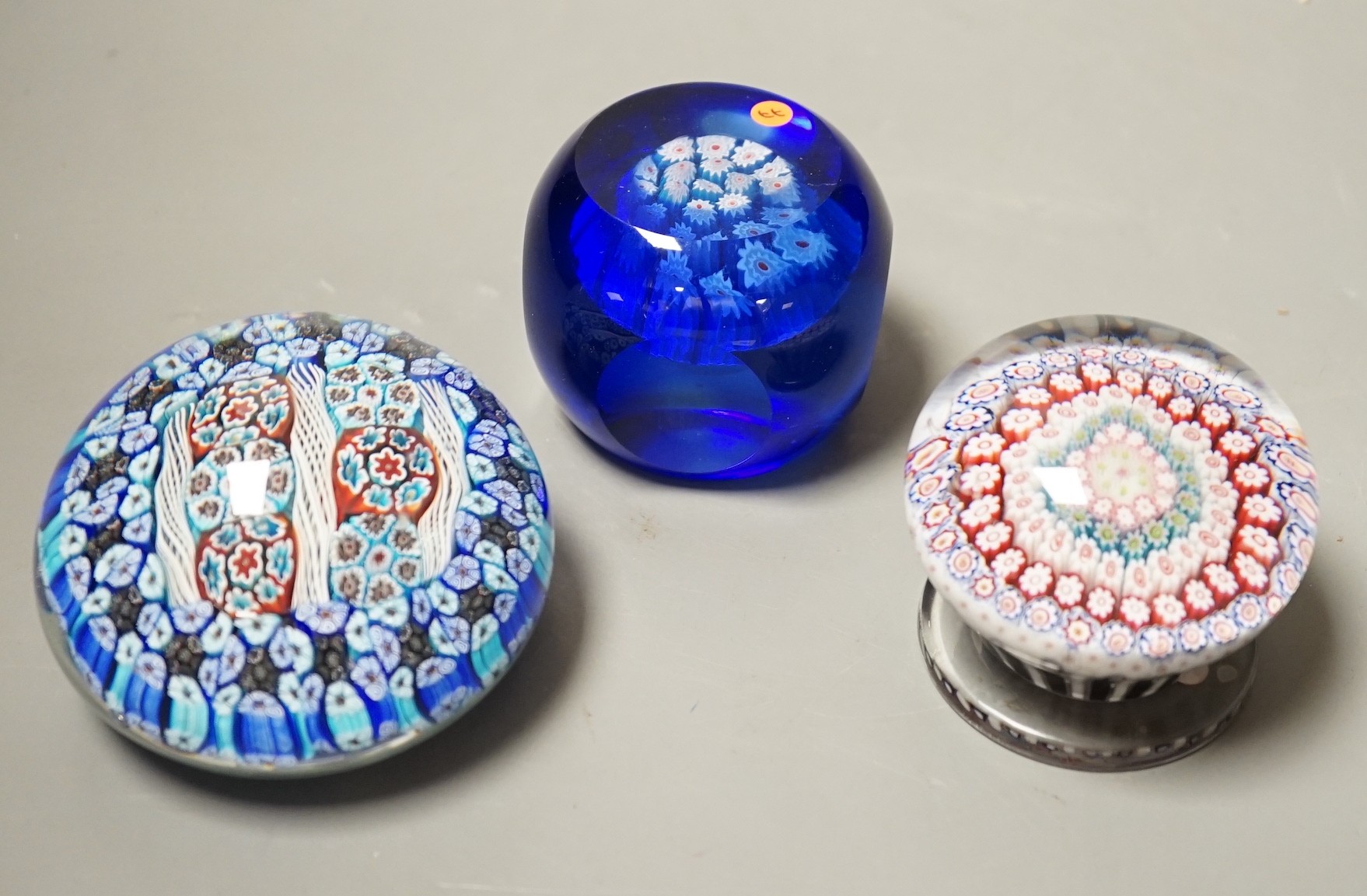 Three millefiori glass paperweights, largest 8cm diameter